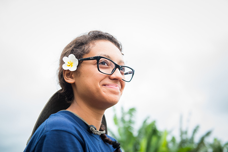 A student smiling at Pacific Quest